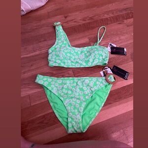 cute bright green swimsuit with white flowers !!